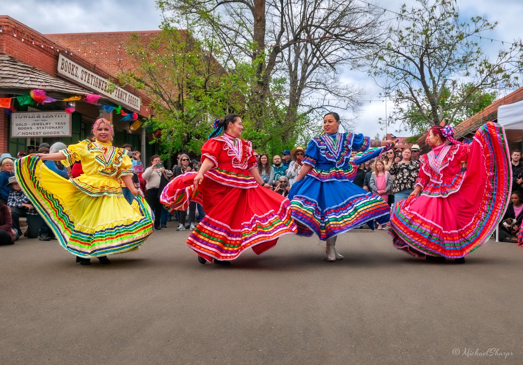Colorful folk dancers performing at a Cinco de Mayo festival in Columbia
